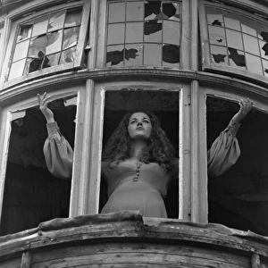 Woman posing with broken windows