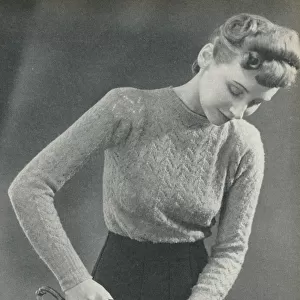 Woman pressing a seam under a damp cloth