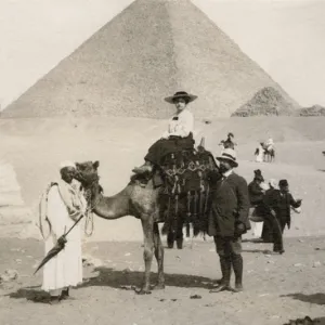 Woman riding a camel in Giza, Egypt