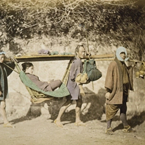 A woman riding in a palanquin