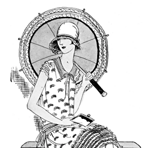 Woman sits with parasol