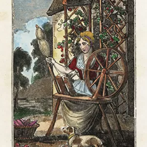 Woman spinning yarn on a spinning wheel in