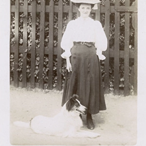Woman taking a dog for a walk