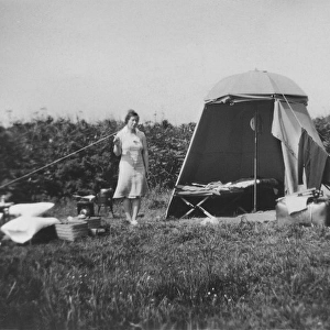 Woman with tent and parked car
