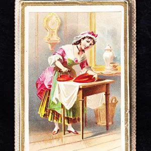 Woman using a heart-shaped iron on a Valentine card