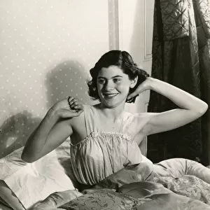WOMAN WAKING 1940S