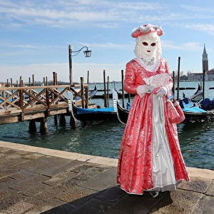 Woman wearing Venice Carnival Costume and Gondolas