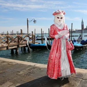 Woman wearing Venice Carnival Costume and Gondolas