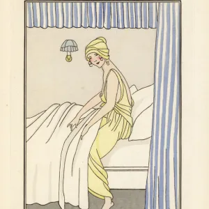 Woman in yellow chiffon night gown and hat getting into bed