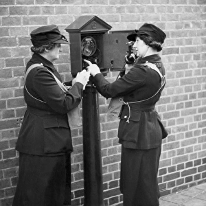 Women of the Auxiliary Fire Service using a telephone, WW2