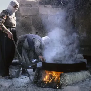 Two women cooking - near mosque, Uchisar, Cappadocia, Turkey Two women cooking - near mosque, Uchisar, Cappadocia, Turkey