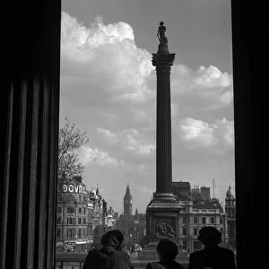 Women look out on Trafalgar Square, London