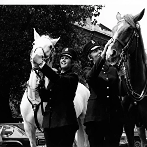 Two women police officers with horses, London