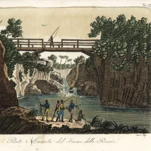 Wooden bridge and waterfall at the River Roccie, Madagascar