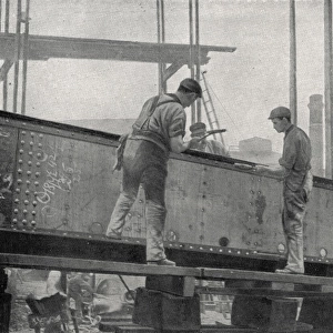 Workers riveting a girder at a Sunderland shipyard