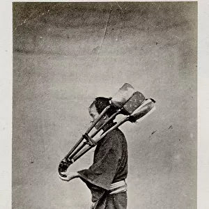 Workman carrying implements, tools, Japan