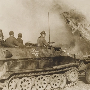 WW2 - German tank driving through a burning Russian village