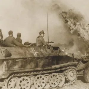 WW2 - German tank driving through a burning Russian village