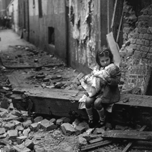 WW2 - Germany - Bombed-out young girl with her doll