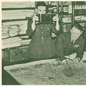 WW2 - R. A. F. Placing Prints On The Map