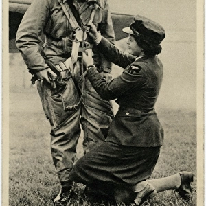 WW2 - With the W. A. A. F. - Helping a pilot with his kit