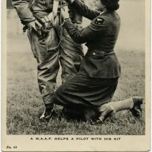 WW2 - With the W. A. A. F. - Helping a pilot with his kit