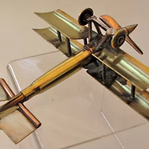 WWI biplane bullet fuselage with copper propeller