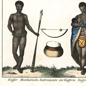 Xhosa man in grass belt and woman suckling a baby