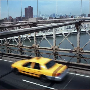 Yellow cab taxi on Brooklyn Bridge, New York, USA Yellow cab taxi on Brooklyn Bridge, New York, USA