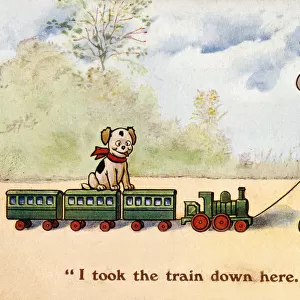 Young boy pulls along his toy train - puppy takes a ride too
