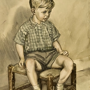 A young boy sitting on a stool