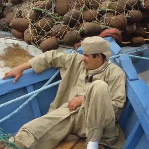Young man in boat, Tunisia Young man in boat, Tunisia