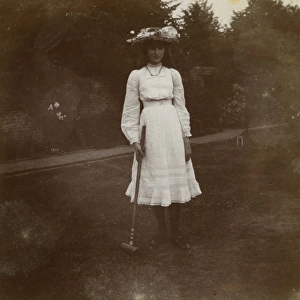 Young woman with croquet mallet, Ealing, West London
