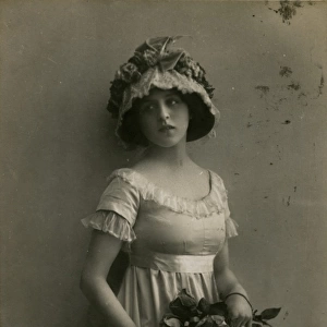 Young woman with roses on a birthday postcard