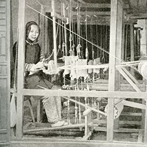 Young woman weaving on a loom, China, East Asia
