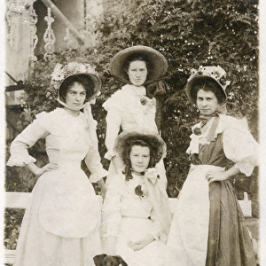 Four young women and a dog in a garden