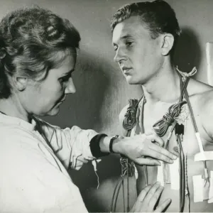 Z. A. Arapova, left, a senior laboratory assistant in a ? Z. A. Arapova, left, a senior laboratory assistant in a ?