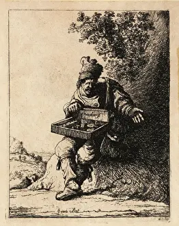 Rembrandt Prints: 17th century Dutch pedlar with straw box of wares seated by a ro