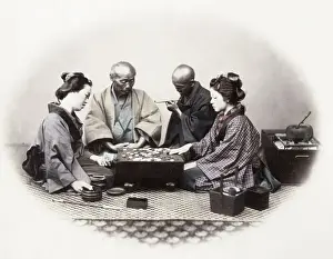 Geisha Prints: 1860s Japan - portrait of a group of men and women playing Go board game Felice or Felix
