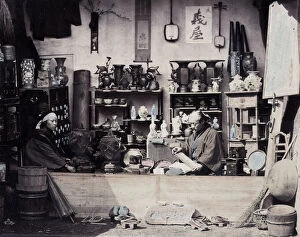 Aoriental Gallery: 1860s Japan - portrait of a two people at a curio or souvenir stall Felice or Felix