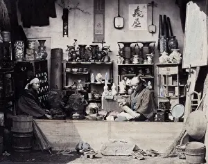 1860s Japan - portrait of a two people at a curio or souvenir stall Felice or Felix