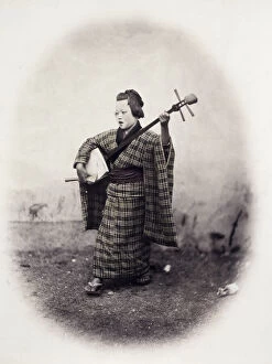 Kimono Gallery: 1860s Japan - portrait of a street singer with a shamisen Felice or Felix Beato