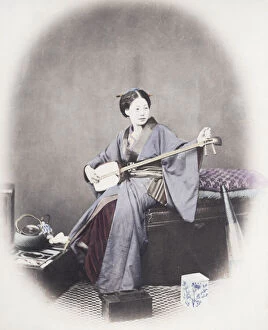1860s Japan - portrait of a young woman musician with a shamisen Felice or Felix Beato