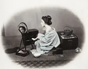 Make Up Prints: 1860s Japan - portrait of a young woman putting on make-up at a mirror Felice or Felix