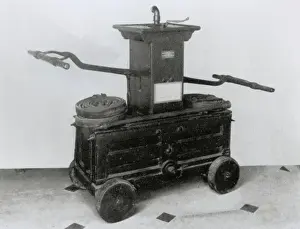 Fittings Prints: 18th century fire engine with leather hose and other fitting