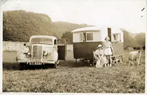 Sedan Prints: 1935 Ford Four-door Sedan Vintage Car with Caravan, England