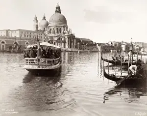 19th century vintage photograph: tourist boaat and gondolas on the Grand Canal, Venice