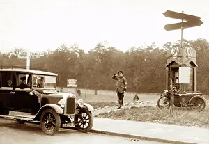 AA patrolman saluting motorist at Garston near Watford