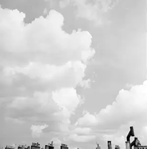 Rooftops Prints: Advertising material -- still life of clouds