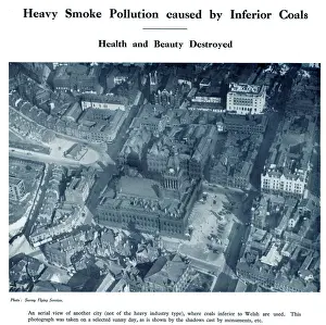 Aerial view of a city with heavy smoke pollution